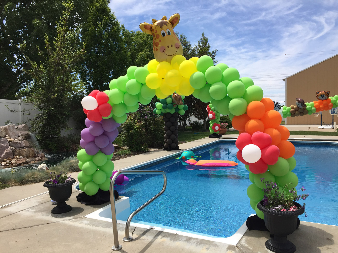 This is a giraffe balloon arch made by an event decorator in Salt Lake City Utah
