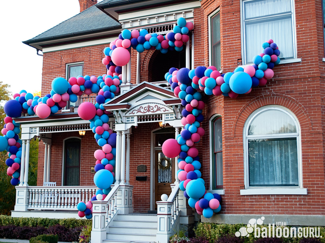 Large organic balloon arch installation for parties and weddings.