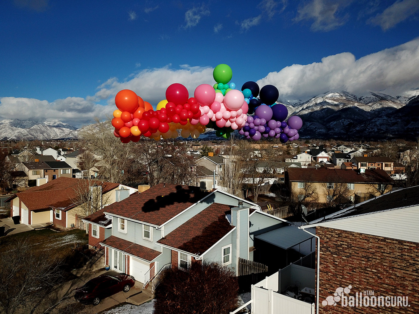 Check out this large organic balloon arch that is almost as big as a house!