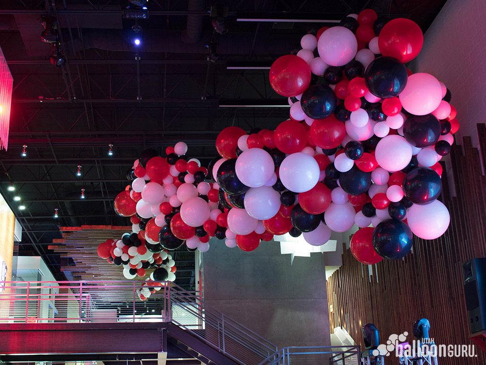 Red white and black organic balloon sculpture made for a party by the Utah Balloon Guru.